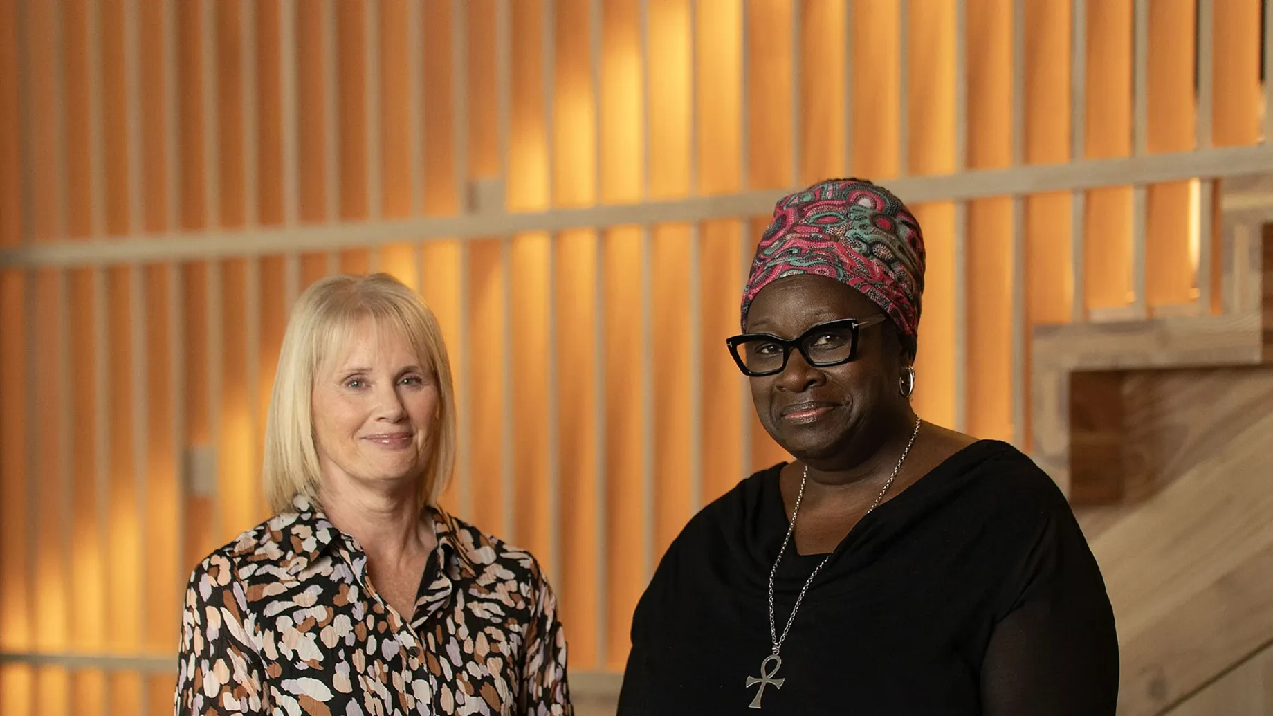 A couple of women posing for the camera.