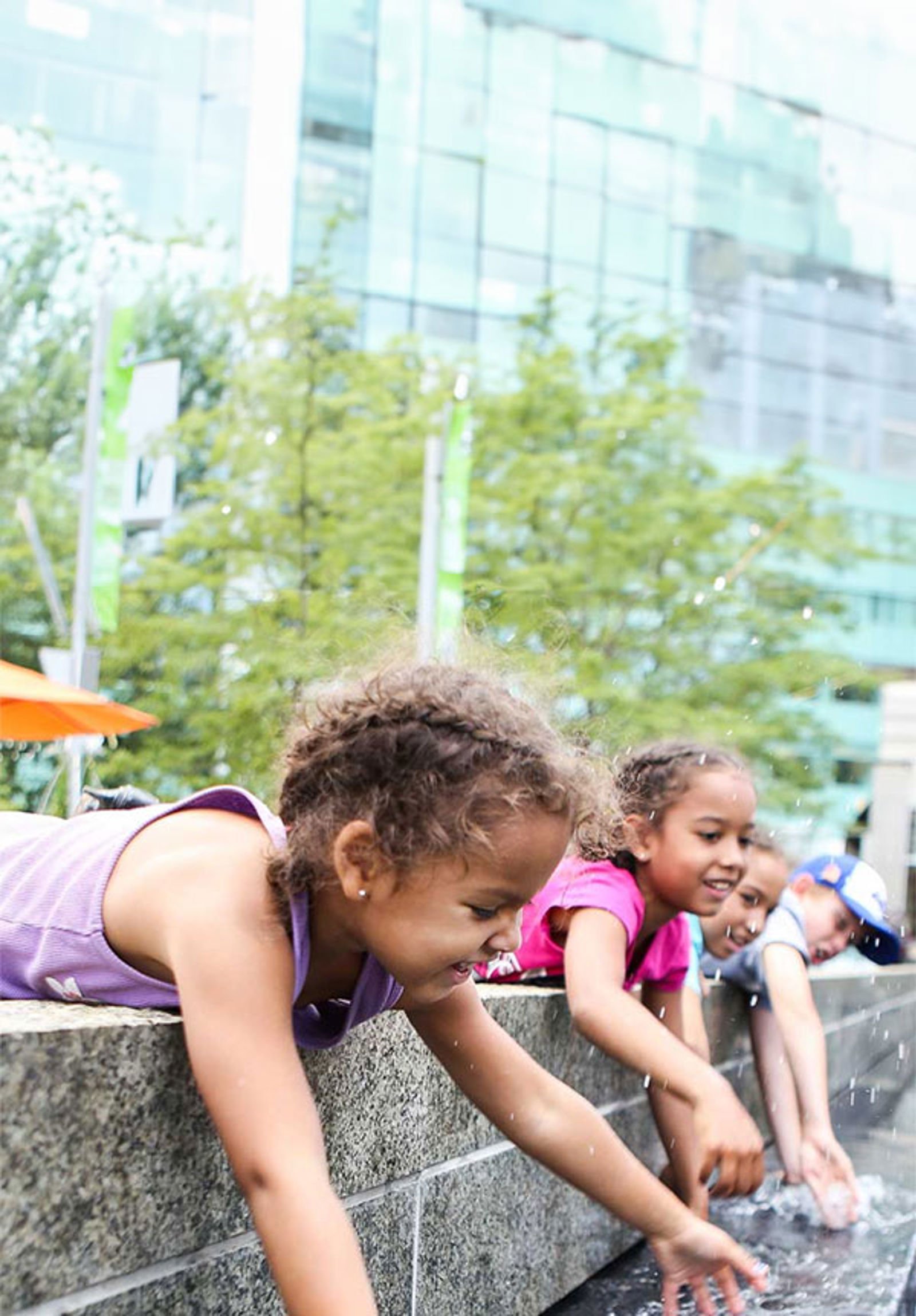 Children playing in a fountain