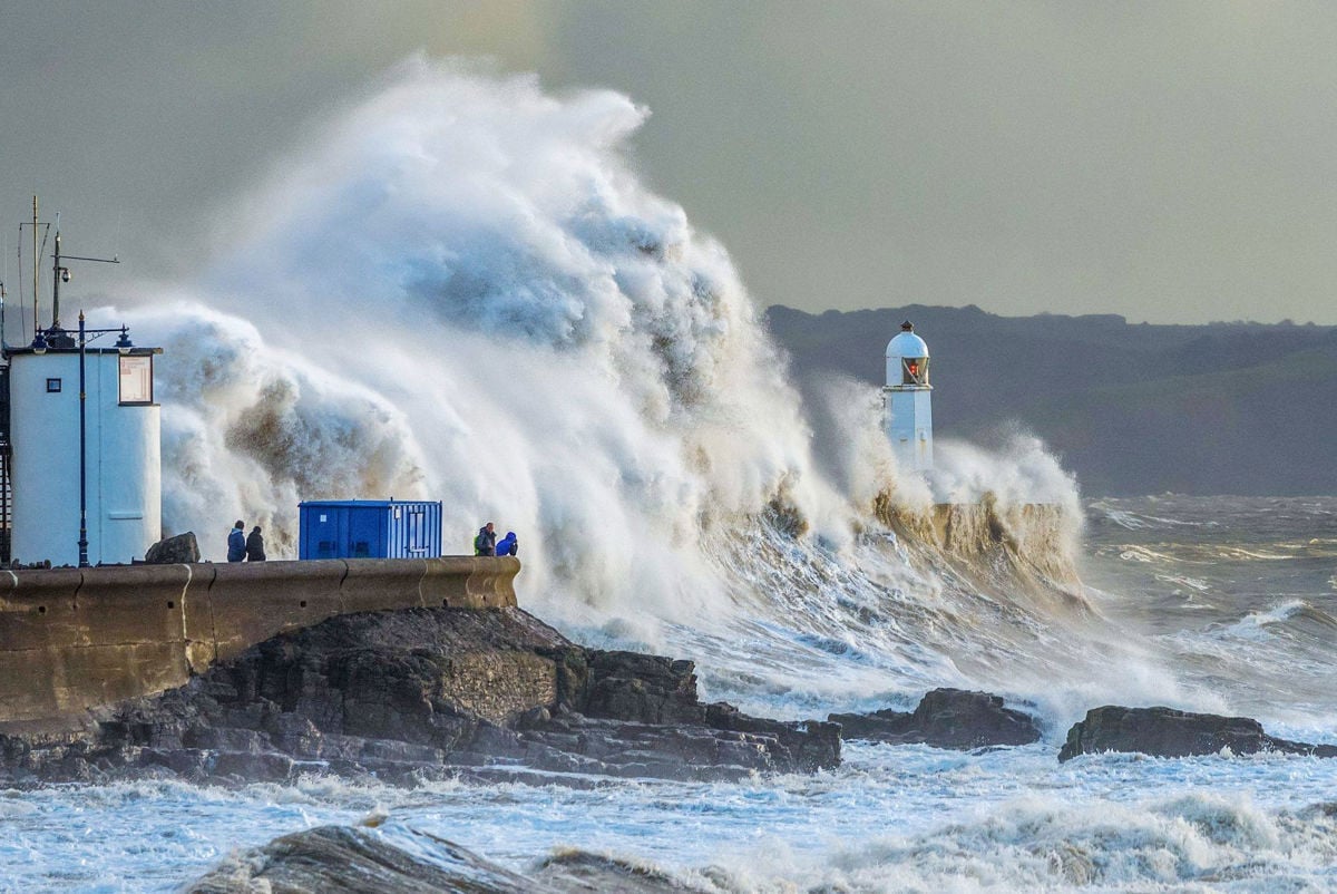 Wave crashing over a coastal wall