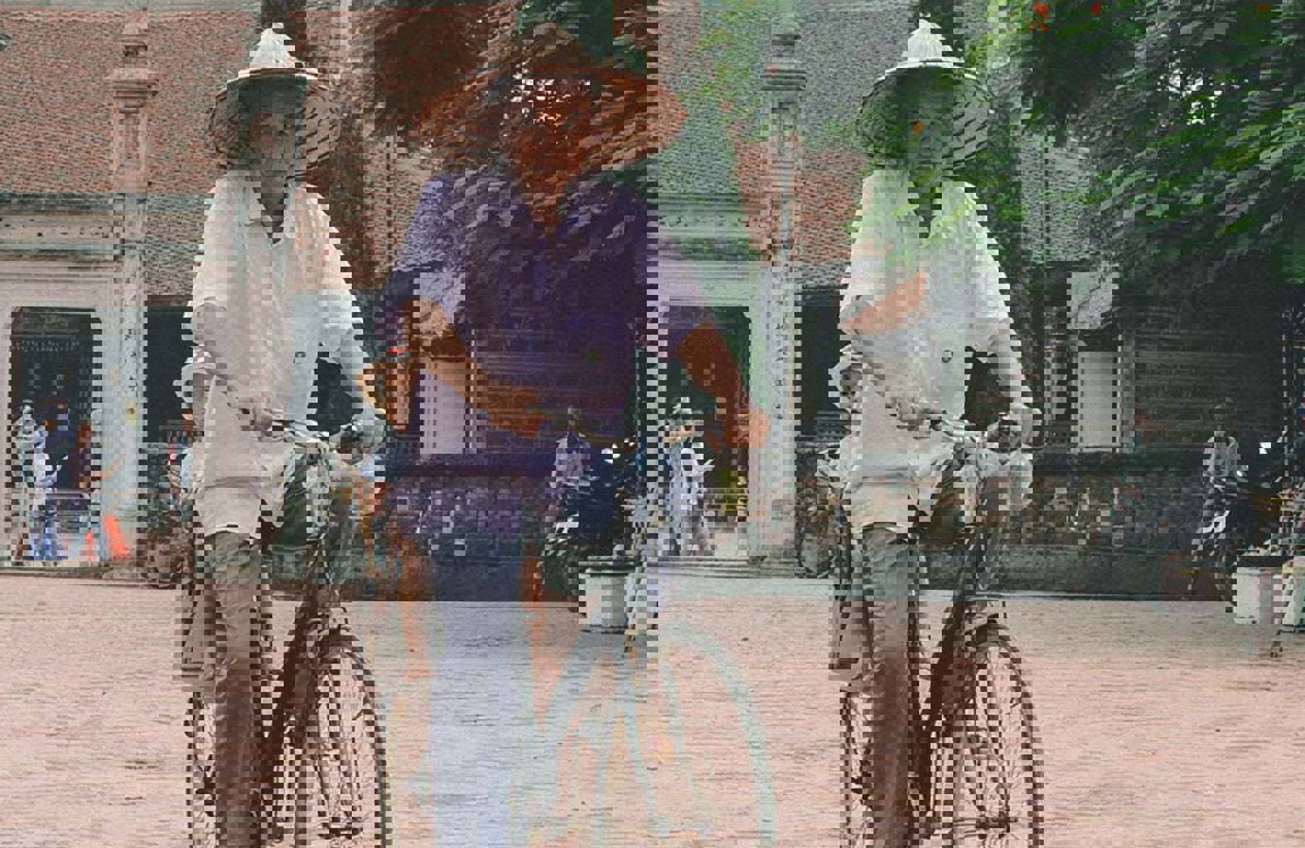 Man and a child on a bicycle