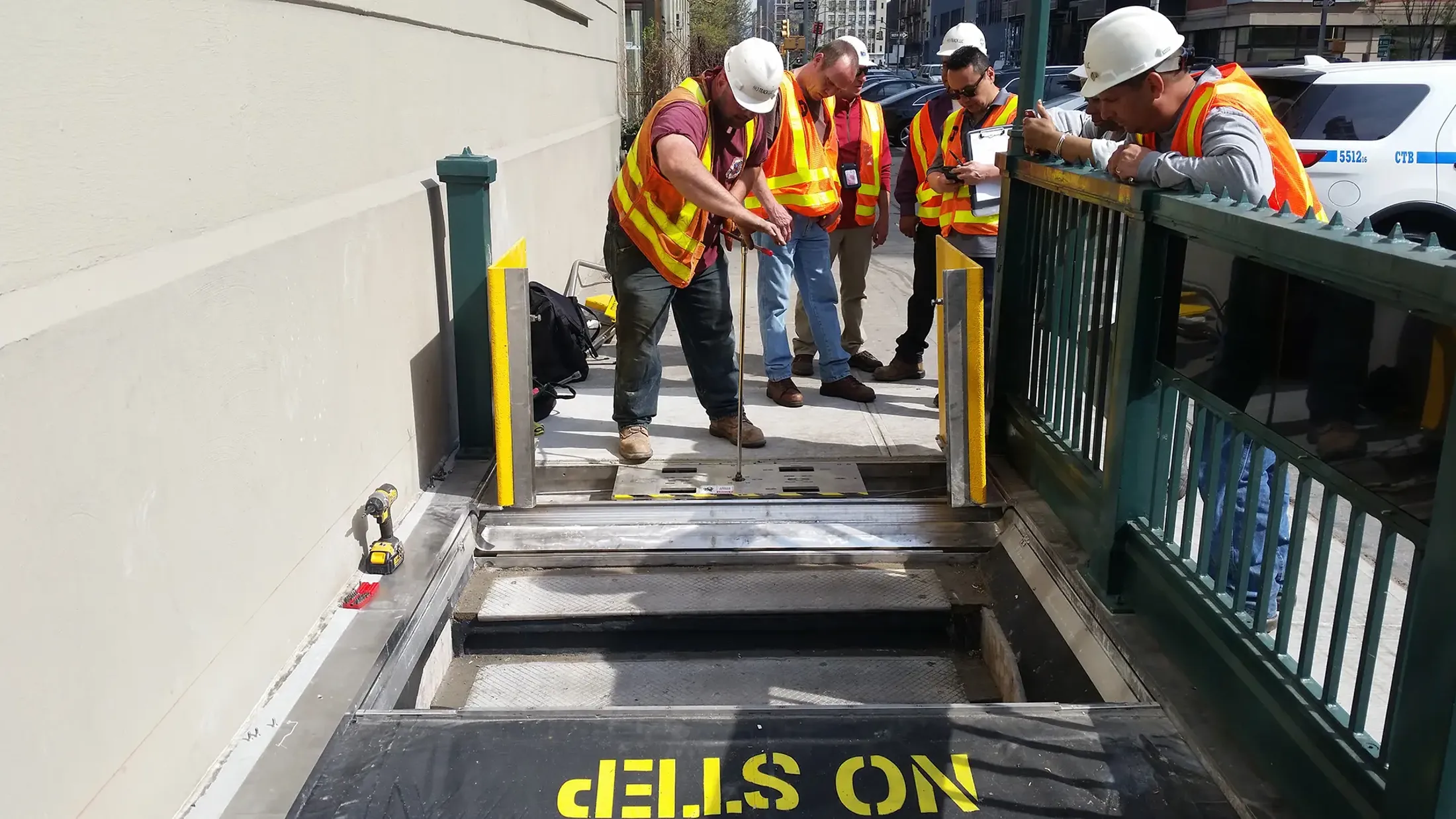 Workers installing flood protections to subway entrances in New York