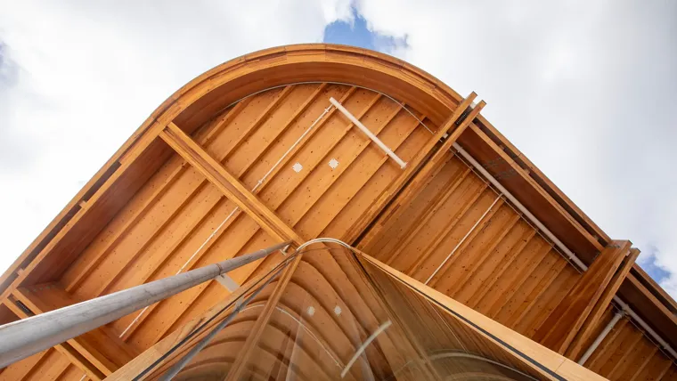 A building with a curved roof.