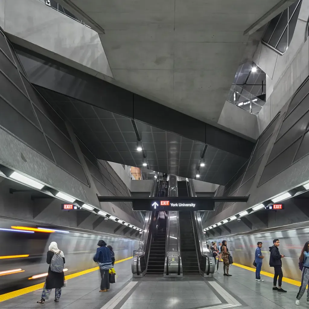 People walking in a train station.