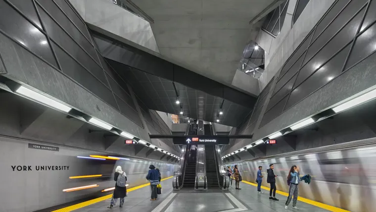 People walking in a train station.