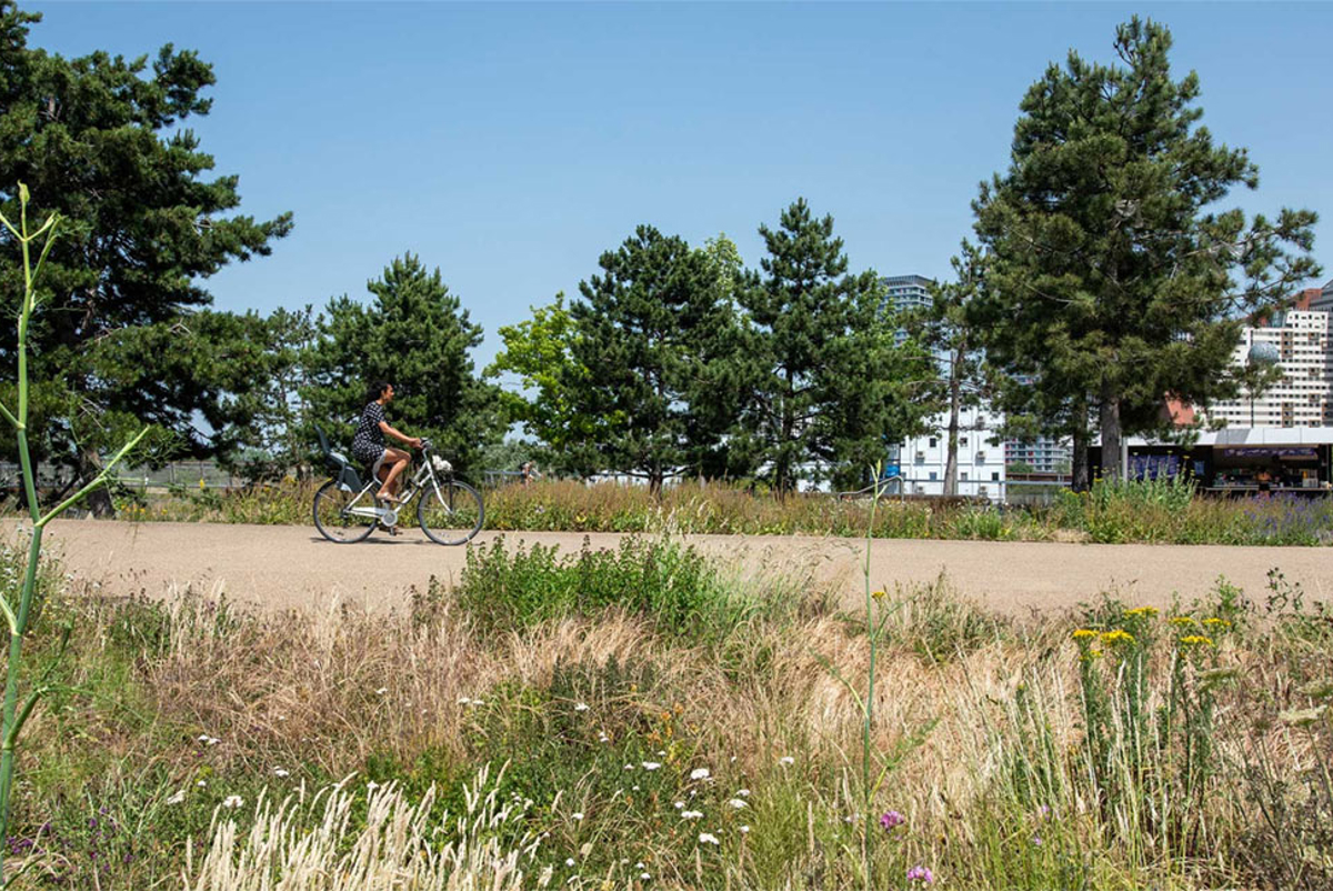 Woman cycling through London's Olympic Park