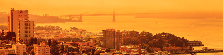 A view across a city in an orange hue