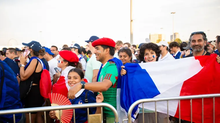 A group of sports fans standing together outside
