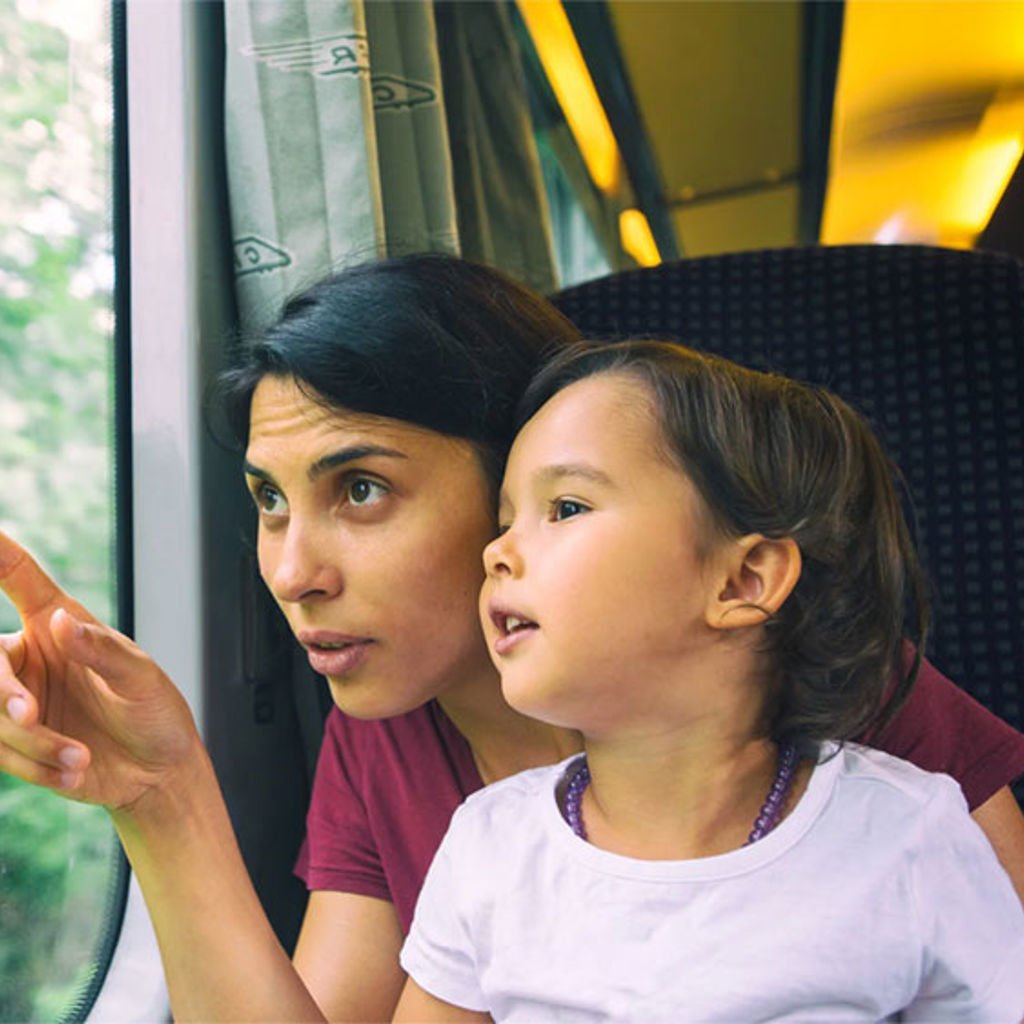 Mother and child looking out of a train window