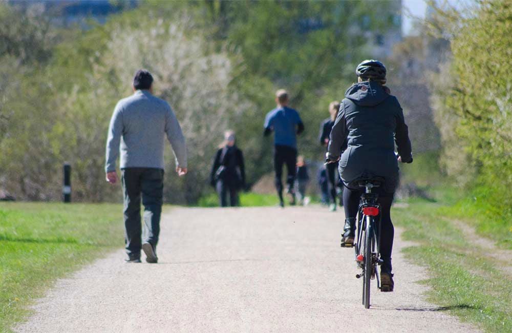 People walking and cycling along a path