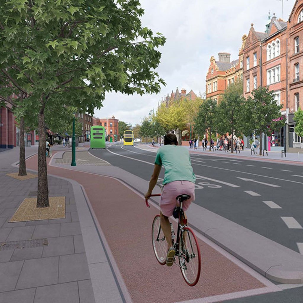 Visualisation of the proposed Belfield/Blackrock to City Centre scheme, showing a cyclist, buses and pedestrians.