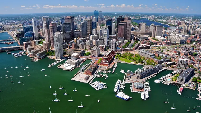 An aerial view of Boston with boats in the harbor