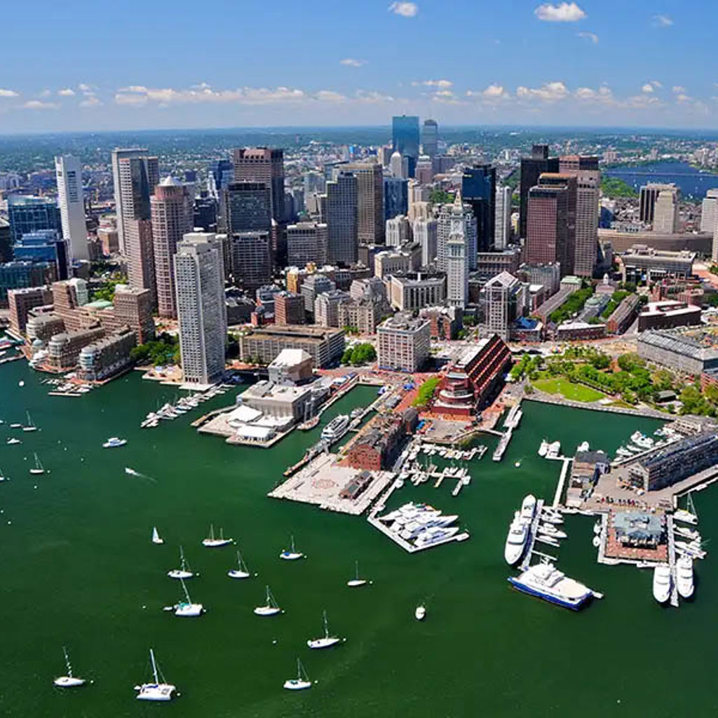 An aerial view of Boston with boats in the harbor