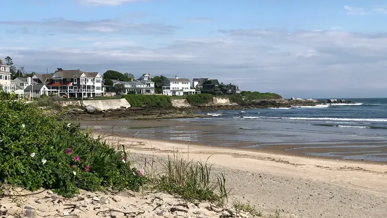 A coastline with houses along the beach