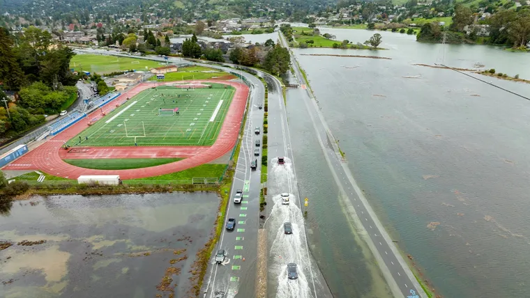 Cars driving on flooded highway in Marin County