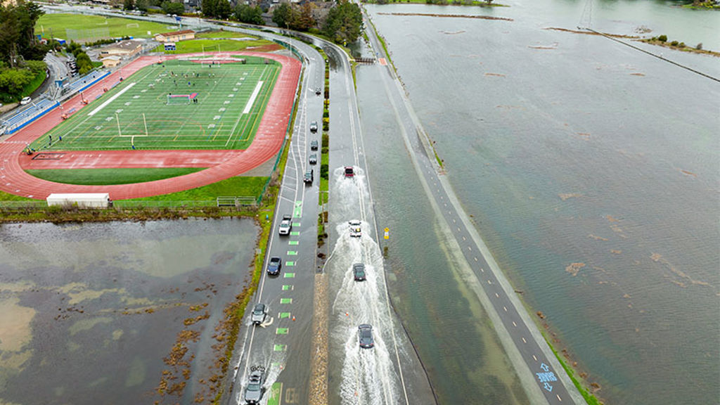 Cars driving on flooded highway in Marin County