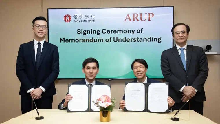 A group of men holding papers.