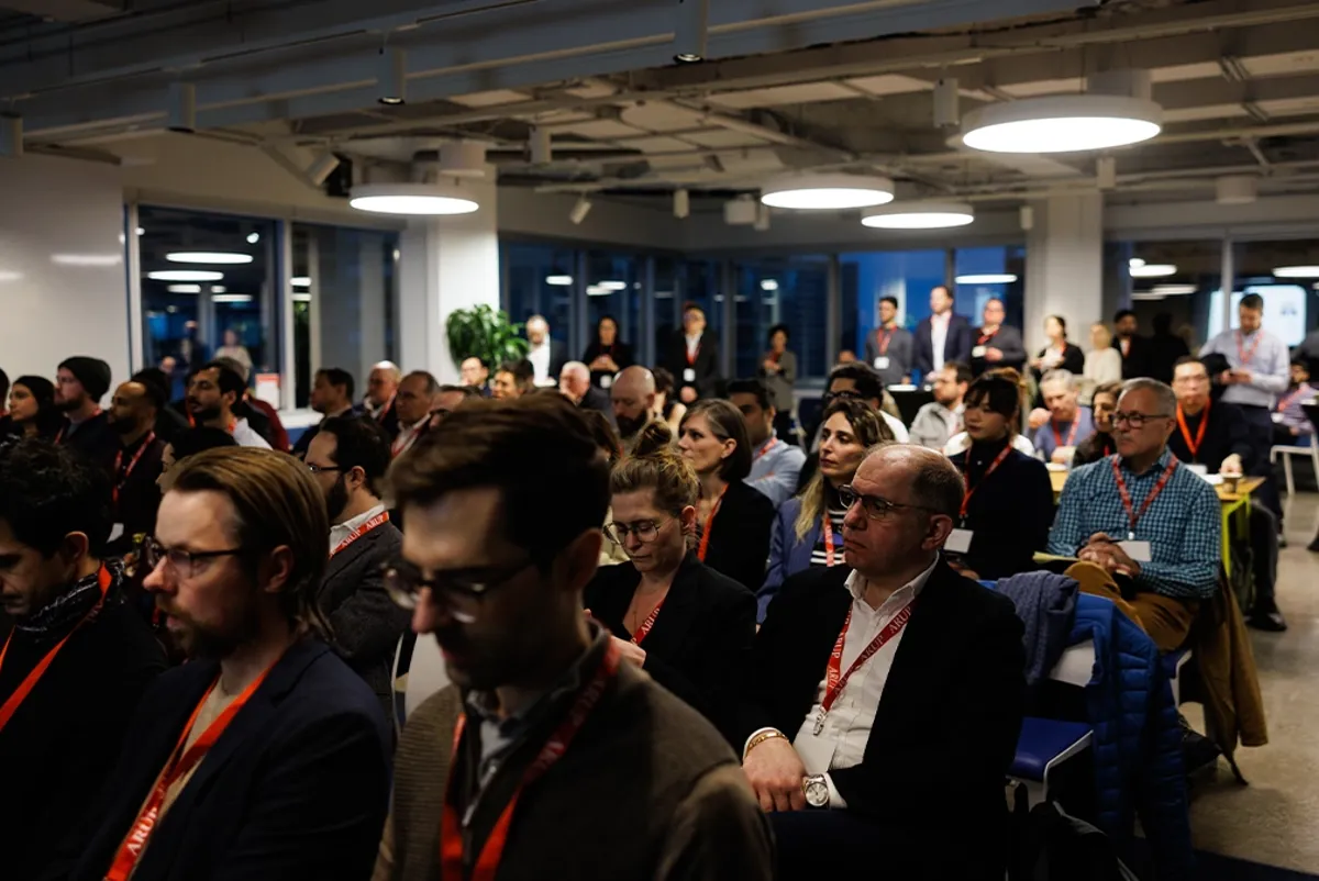 A large group of people sitting in a room