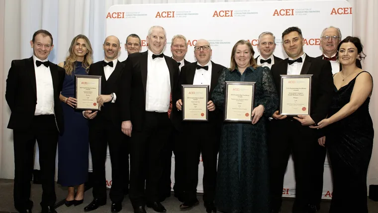 Arup staff members holding the four ACEI award certificates.