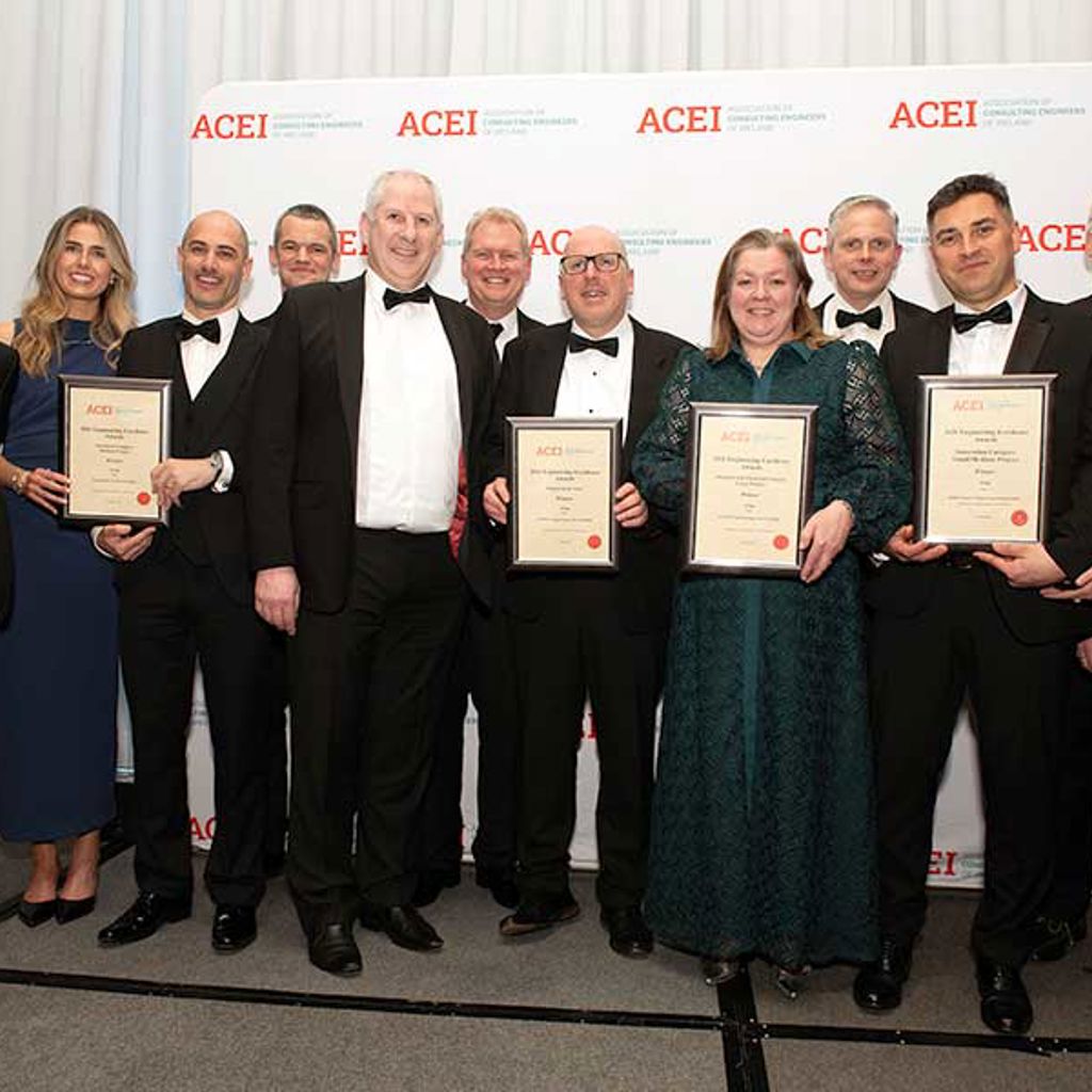 Arup staff members holding the four ACEI award certificates.