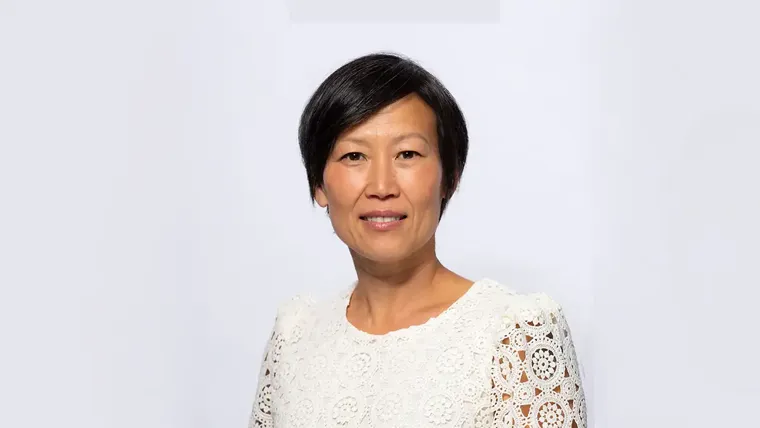 A woman smiling for the camera.