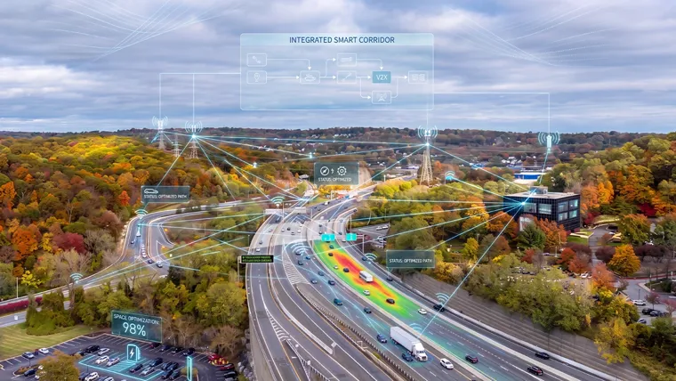 A highway with cars overlayed with digital vectors illustrating a smart connected corridor