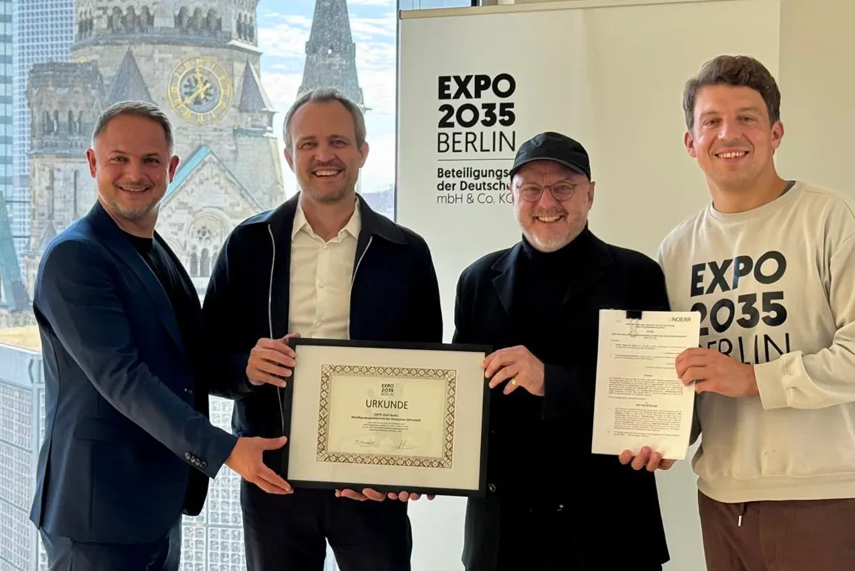 A group of men holding certificates.