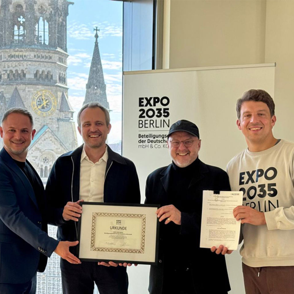 A group of men holding a certificate.
