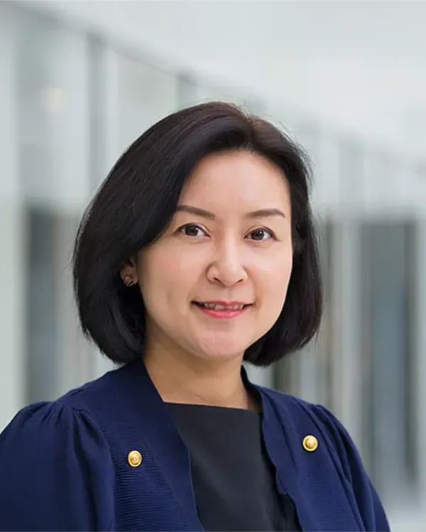 A woman in a blue shirt.