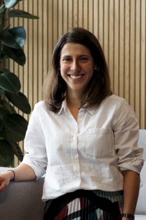 A woman sitting on a couch.
