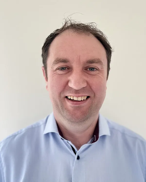 A man smiling for the camera.