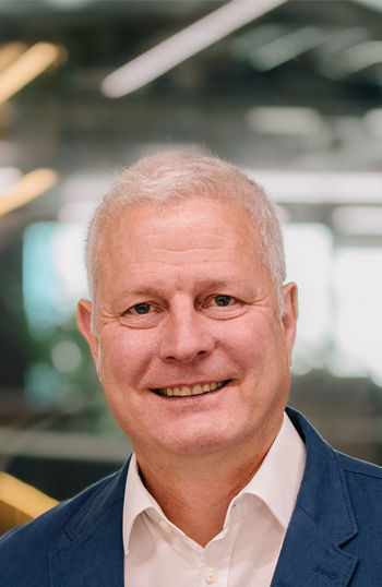 A man smiling for the camera.