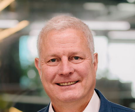A man smiling for the camera.