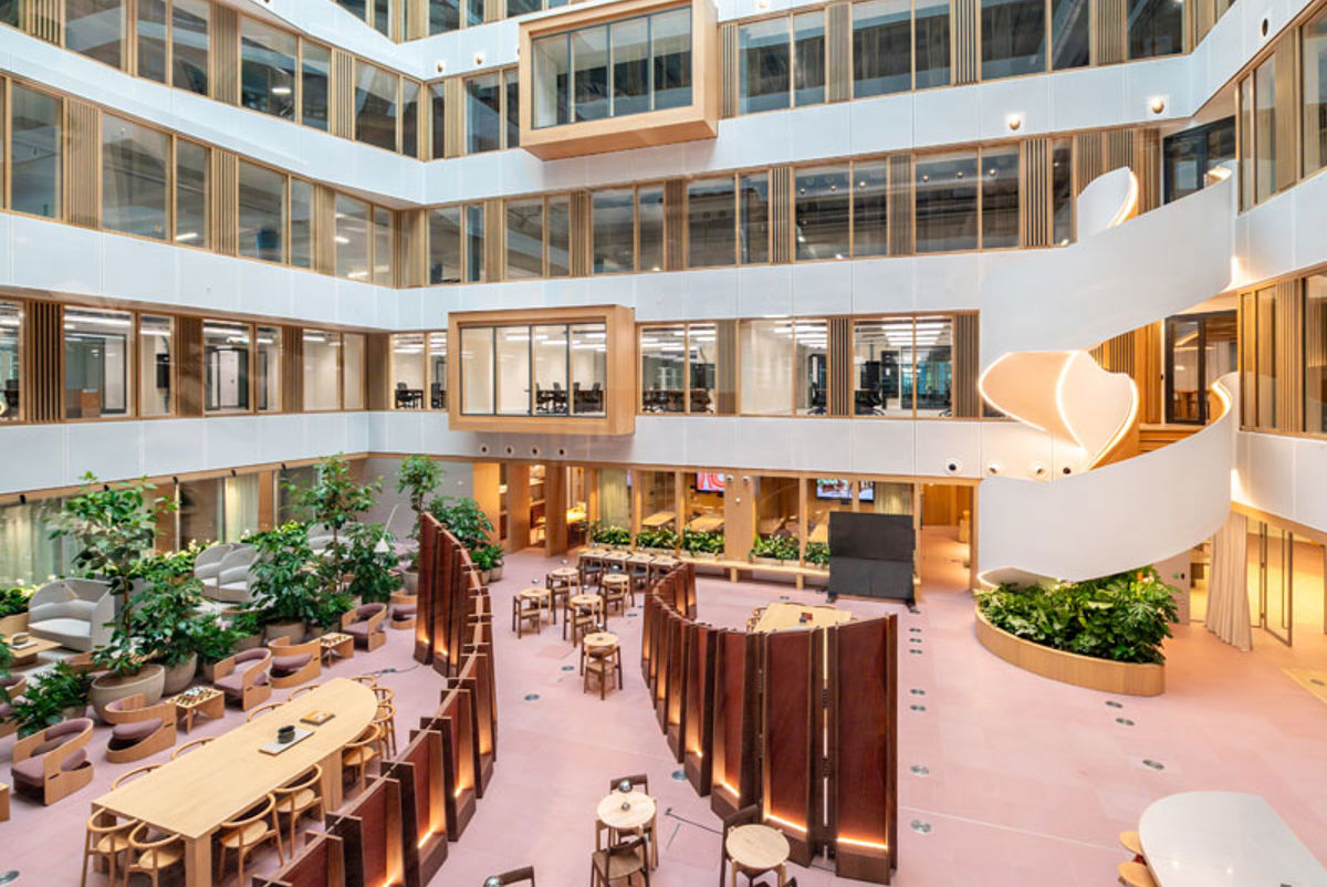 A large building with tables and chairs.