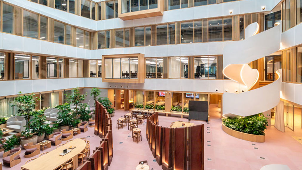 A large building with tables and chairs.
