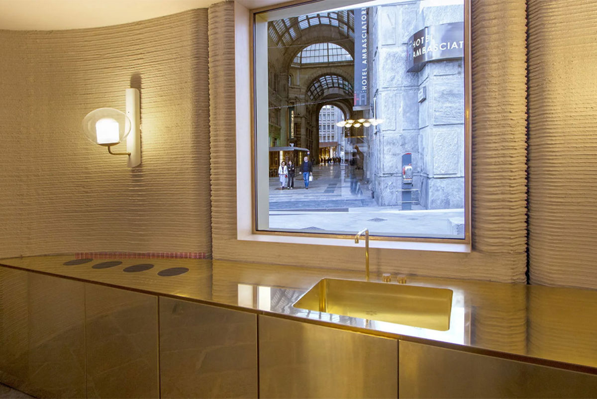 A kitchen space inside a 3D printed concrete house