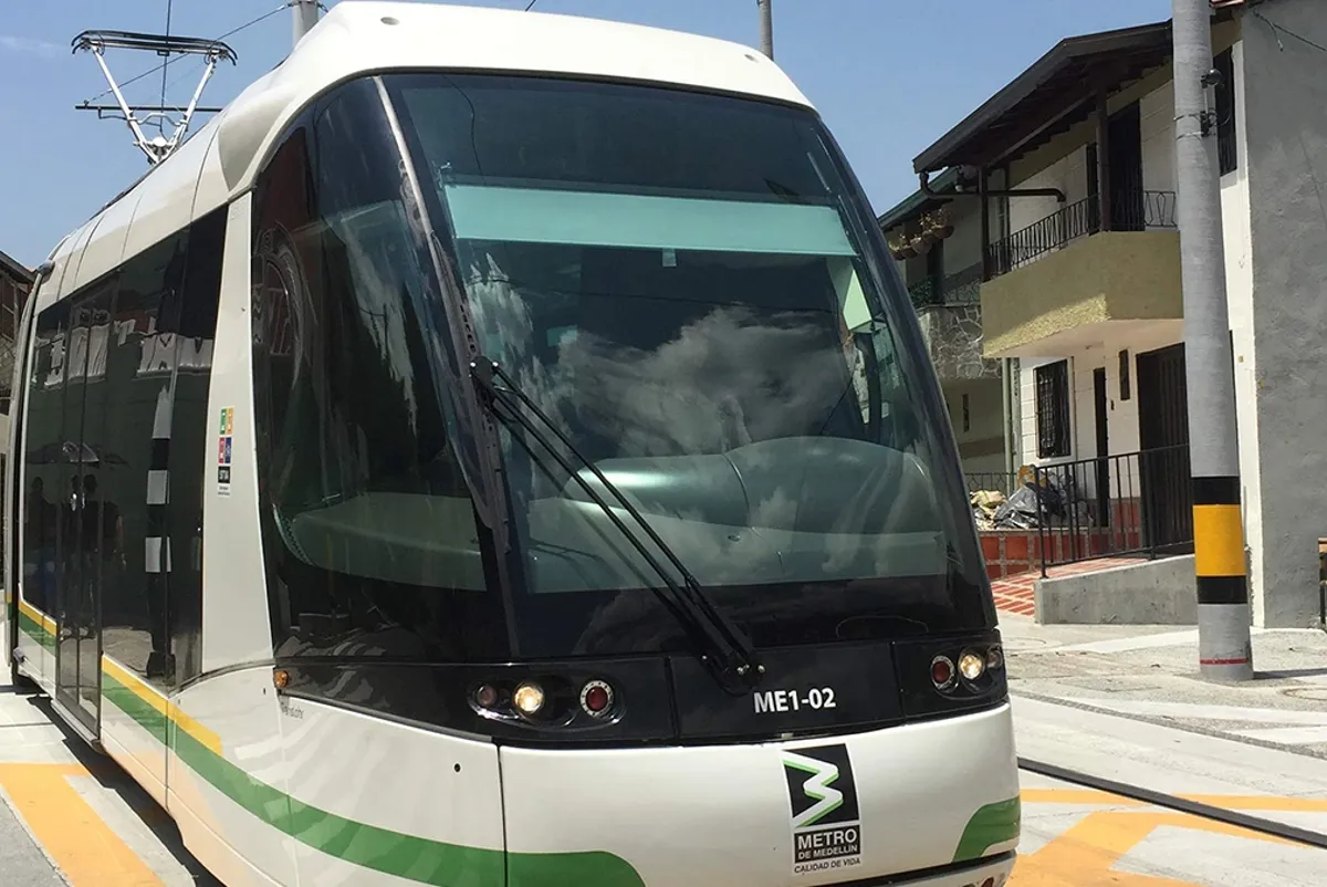 A train on street level tracks
