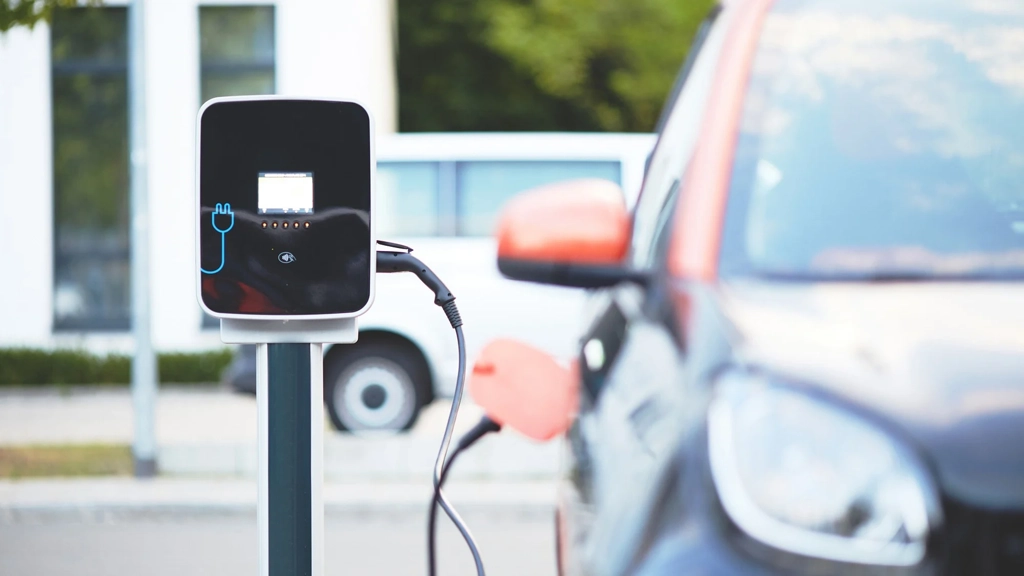 An electric vehicle being charged