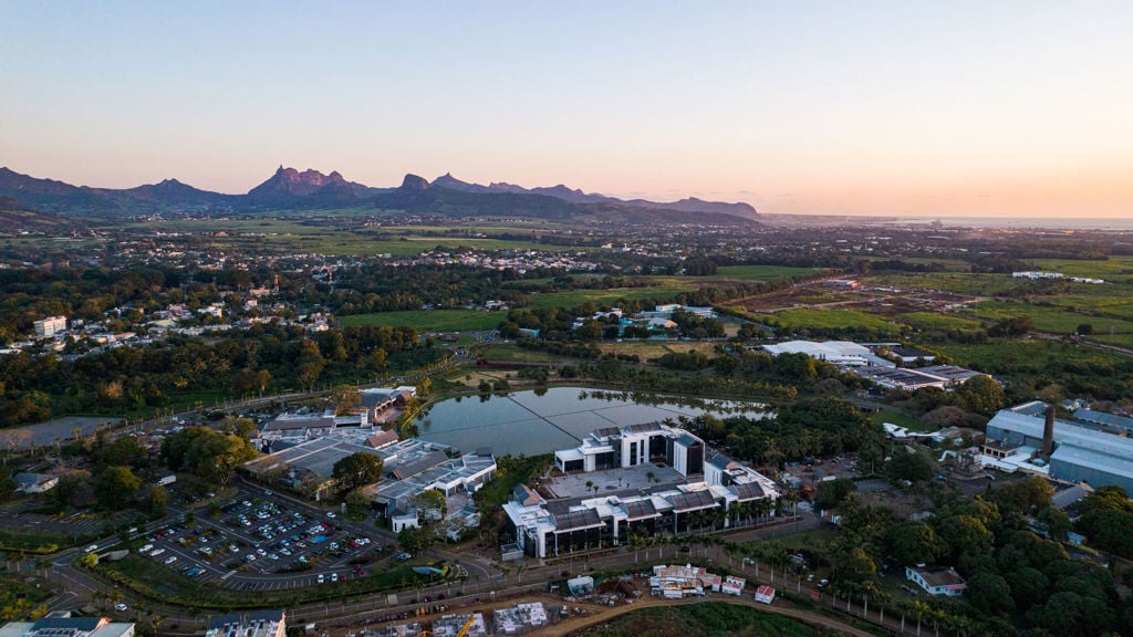 Aerial view of a town with mountains in the background