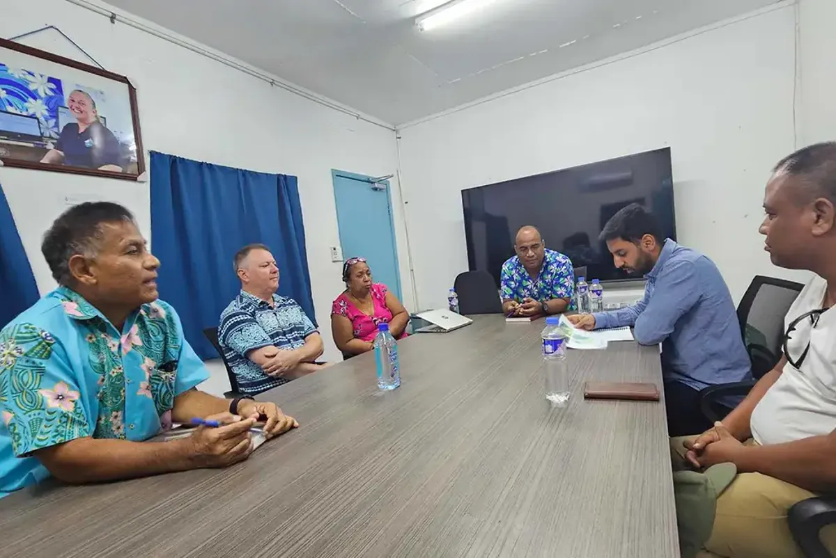 A group of people sitting around a table.