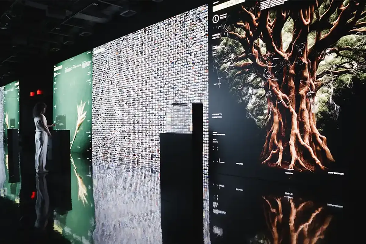 A person standing in the Latent Gallery at Dataland
