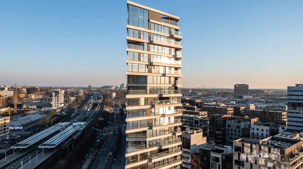 Exterior shot of HAUT, a tall timber-hybrid residential building. Credit: Jannes Linders