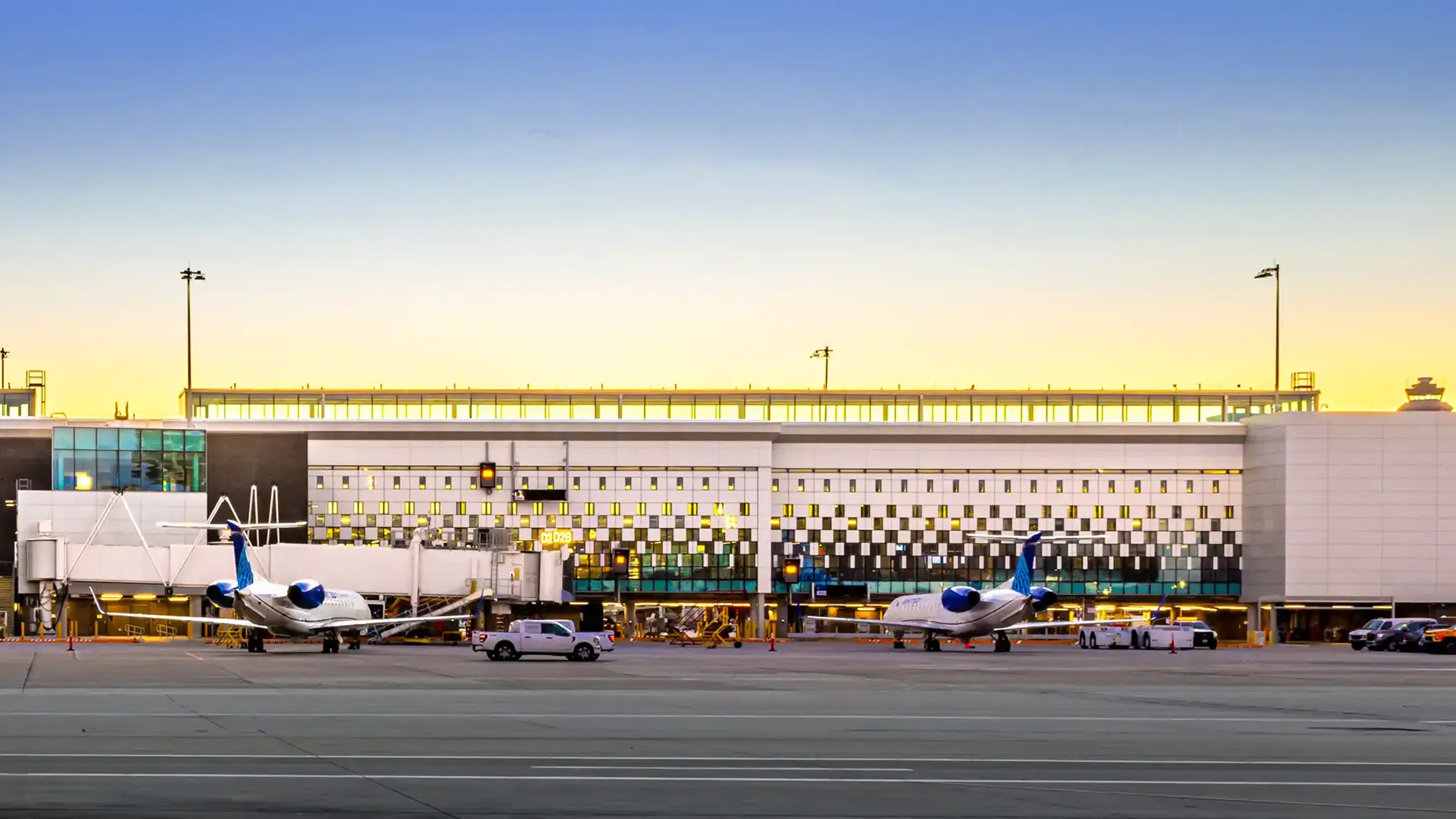 A couple of airplanes at an airport.