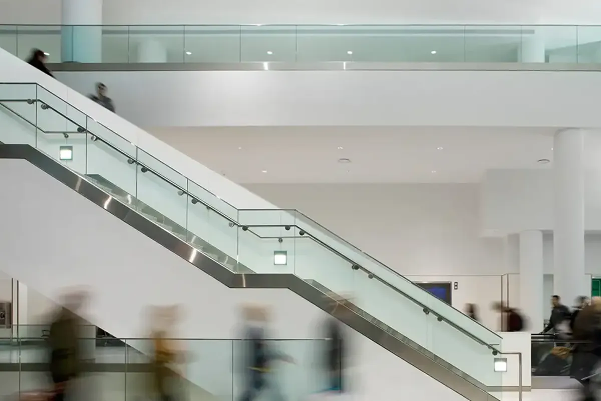 A group of people walking up a staircase.