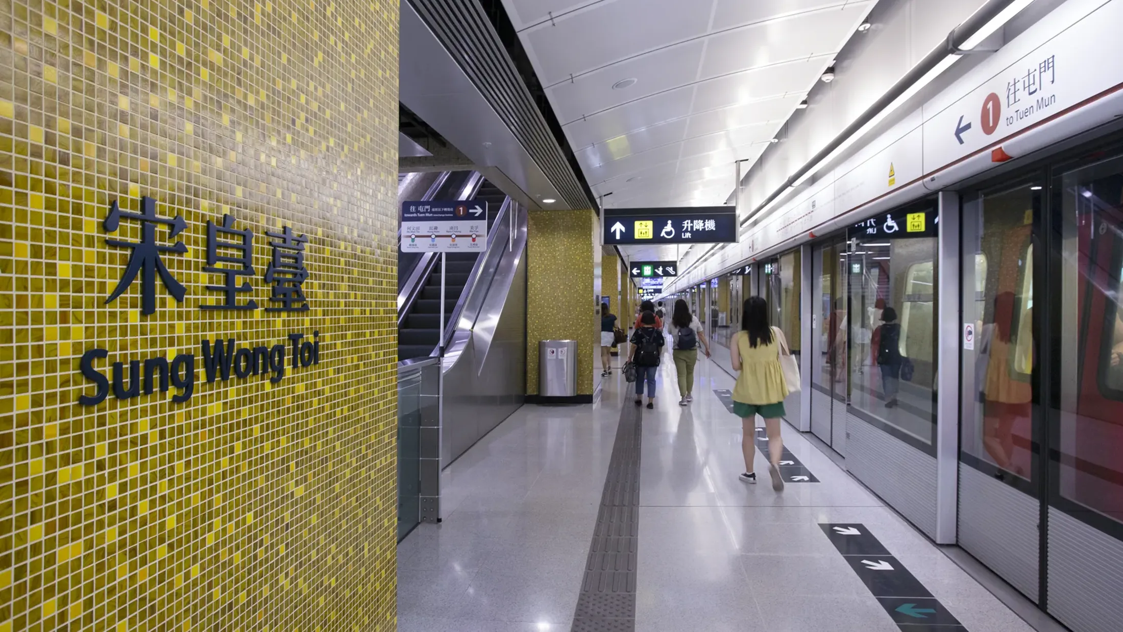 People walking in a subway station.