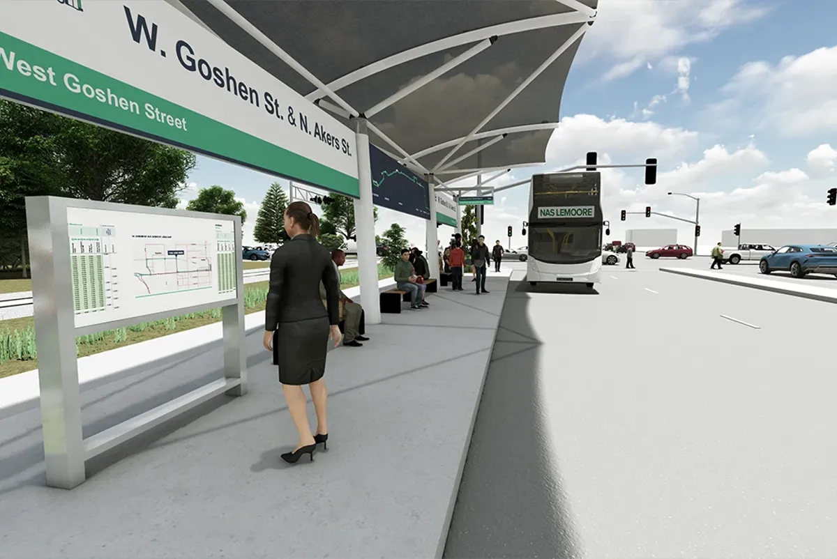 A person standing next to a bus stop waiting to board
