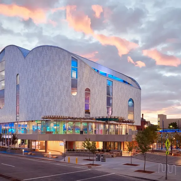The exterior of La Nube, with colorful and illuminated windows