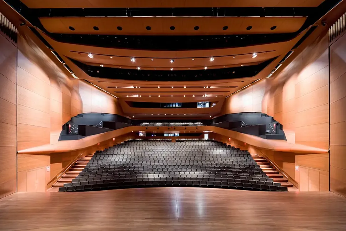 A large staircase with a wood floor.