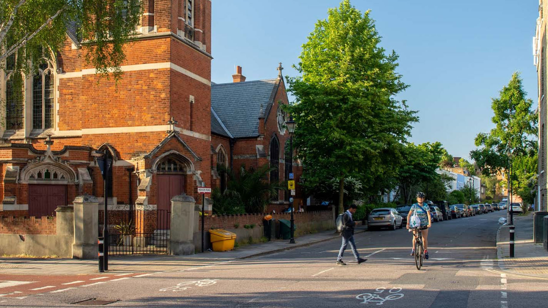 A cyclist and pedestrians on a street in Lambeth, London