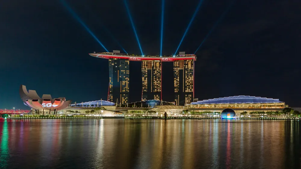 An exterior shot of Marina Bay Sands at night