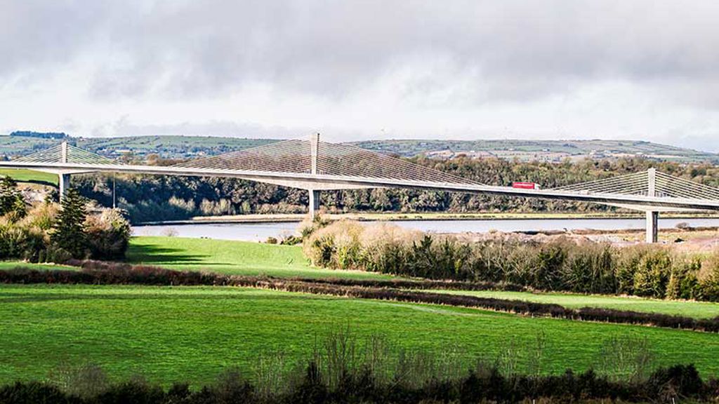 Lorry travelling across Rose Fitzgerald Kennedy Bridge with fields visible in foreground
